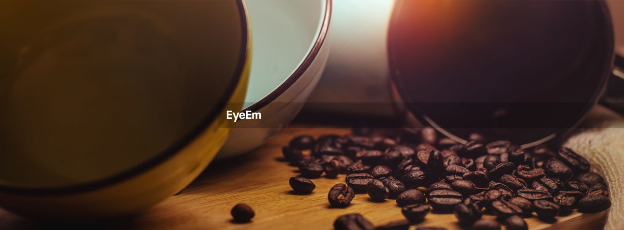 CLOSE-UP OF COFFEE CUP ON TABLE