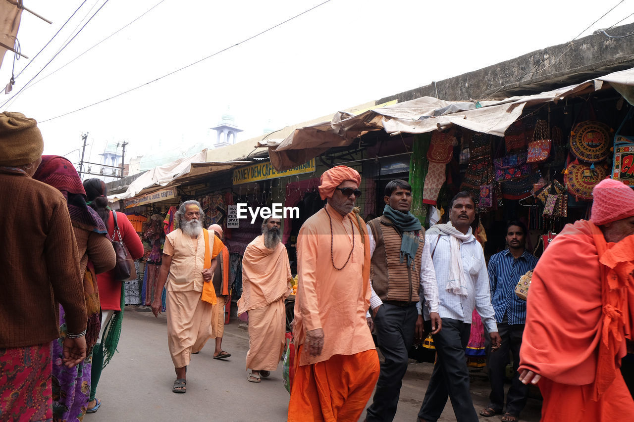 GROUP OF PEOPLE WALKING IN MARKET