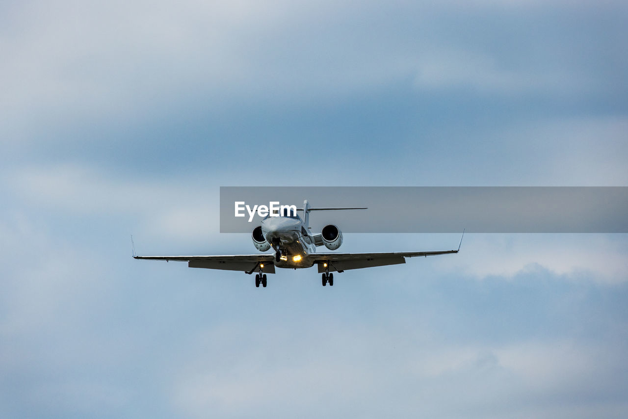 Low angle view of airplane flying in sky