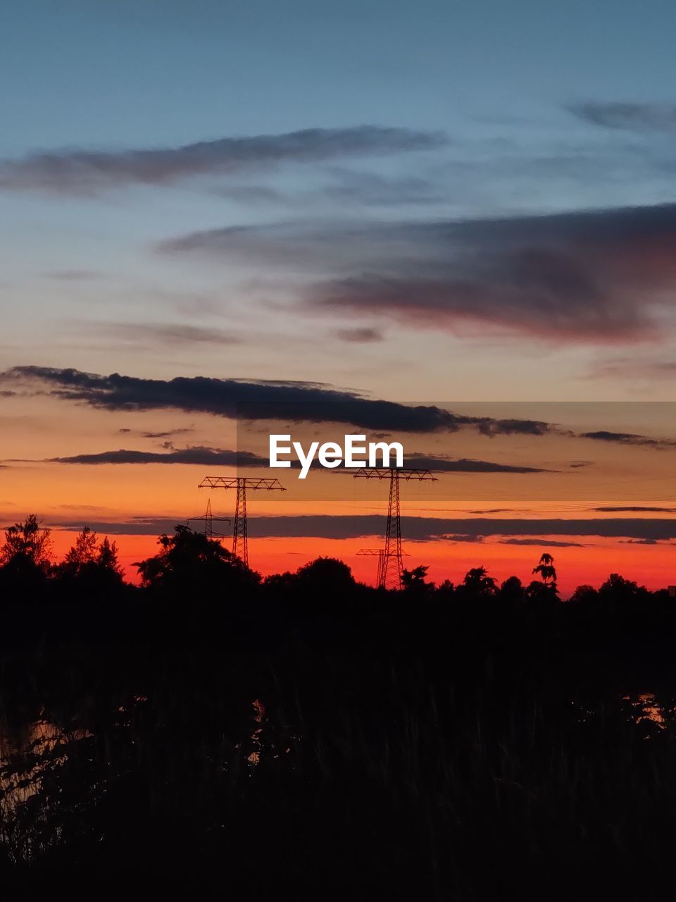 Silhouette landscape against sky during sunset