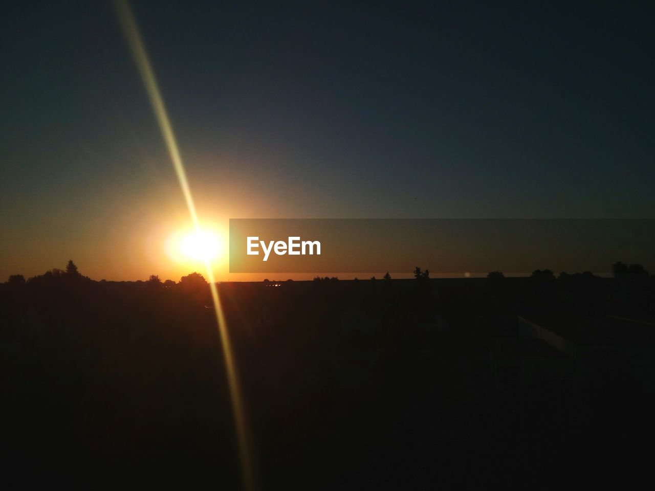 SILHOUETTE OF LANDSCAPE AT SUNSET