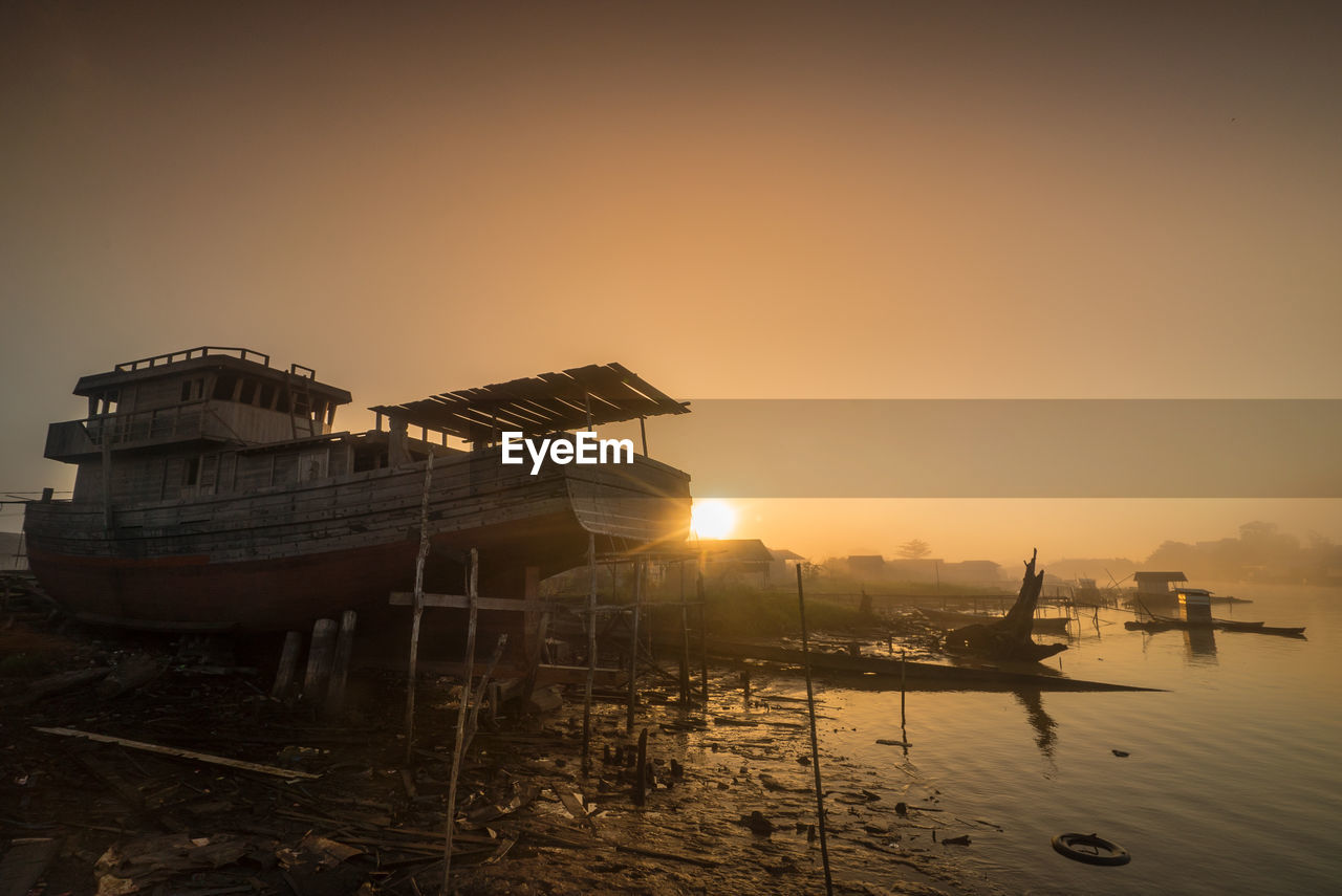 Scenic view of sea against clear sky during sunset