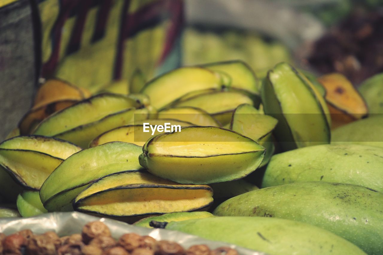 CLOSE-UP OF FRUITS FOR SALE AT MARKET STALL