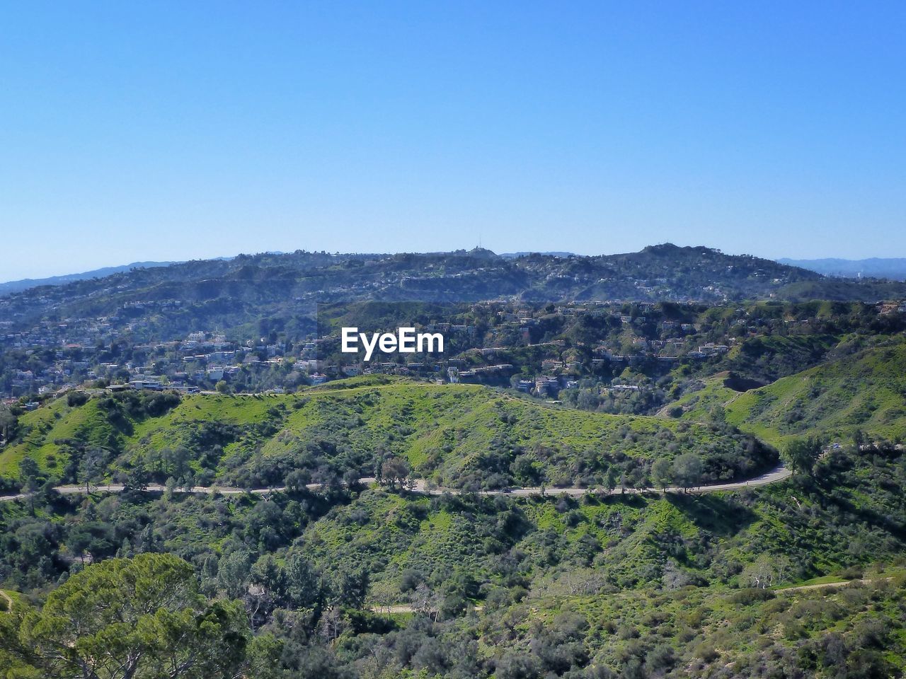 Scenic view of landscape against clear blue sky