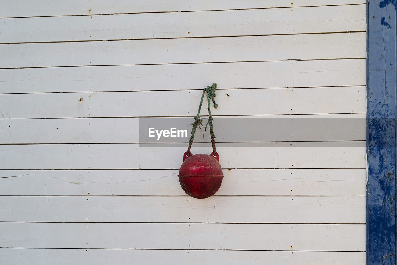 red, wood, hanging, no people, food and drink, food, fruit, healthy eating, day, blue, wellbeing, wall - building feature, freshness, outdoors, produce, still life, nature