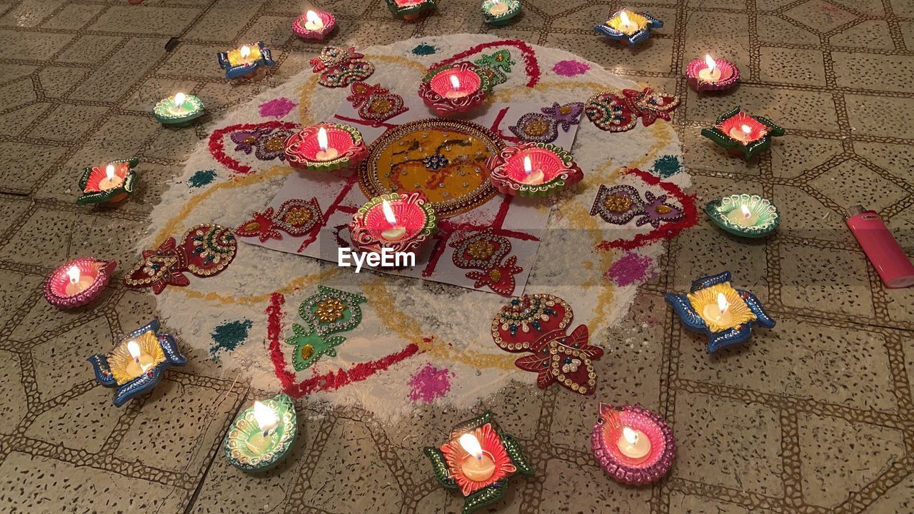 High angle view of rangoli on floor