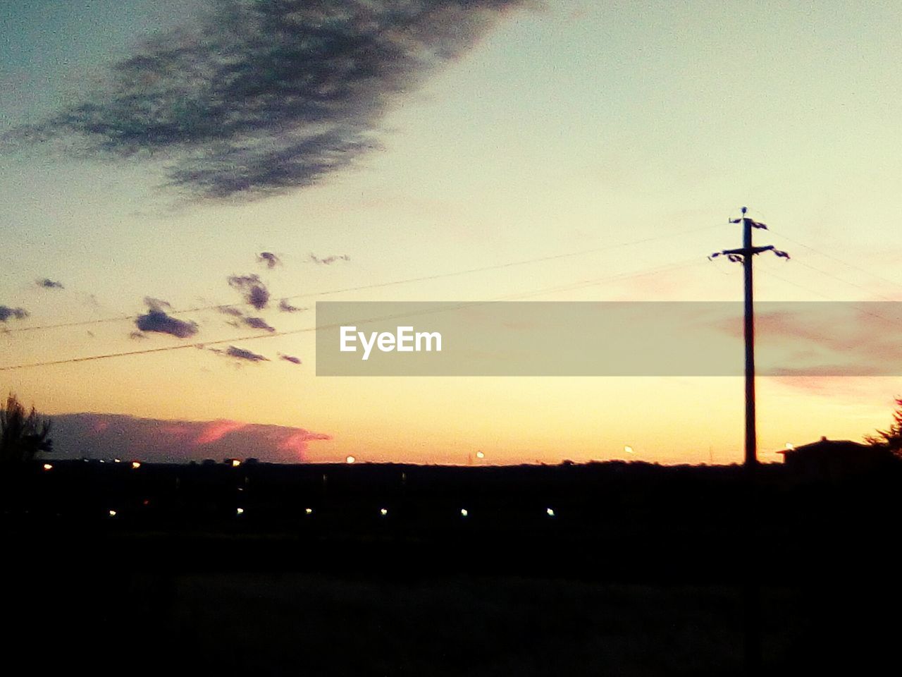 SILHOUETTE OF LANDSCAPE AGAINST SKY DURING SUNSET