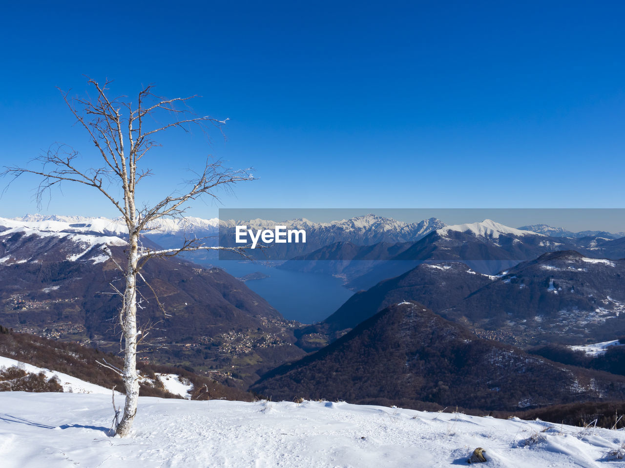 Winter landscape of lake como from valle intelvi alps