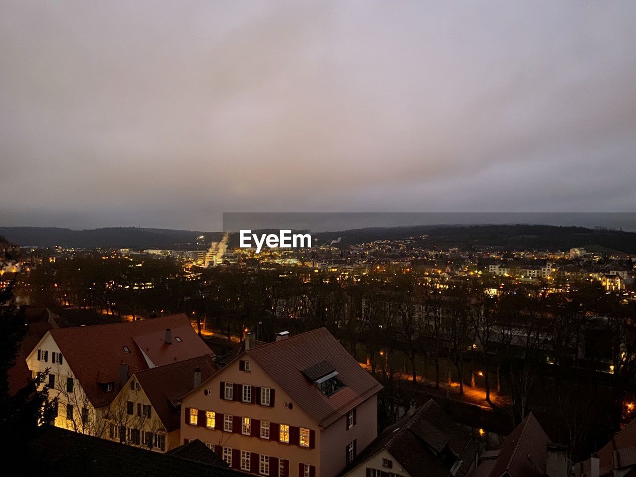 High angle view of illuminated buildings in city against sky