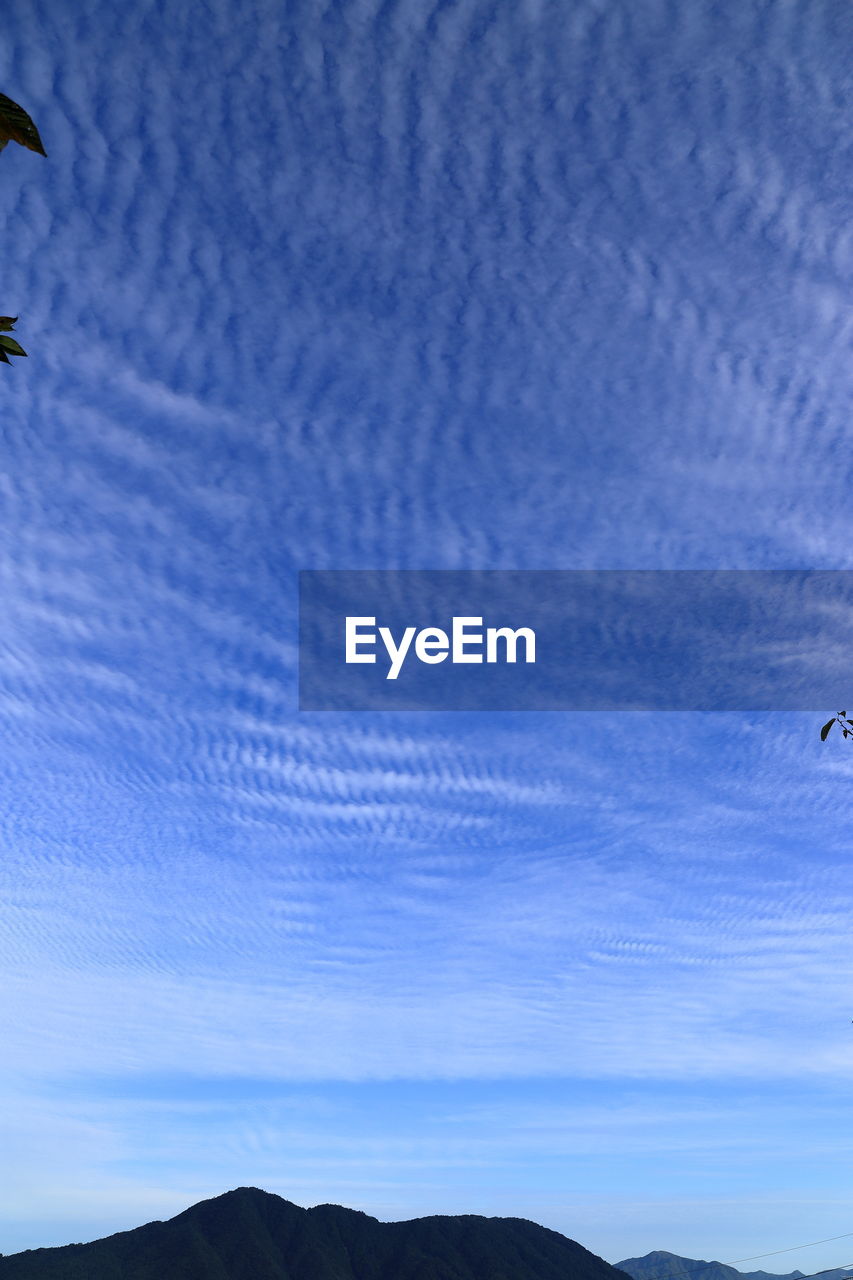 LOW ANGLE VIEW OF SILHOUETTE MOUNTAINS AGAINST SKY