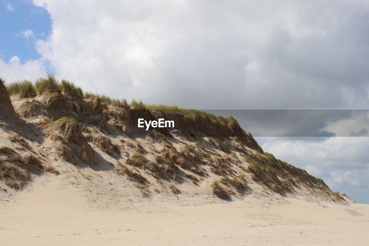 Scenic view of dune against sky