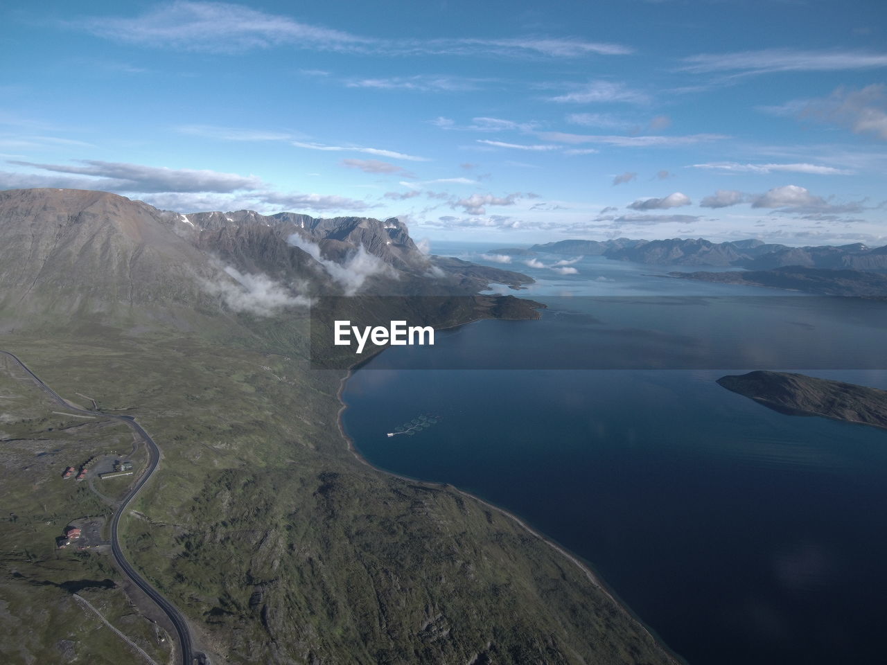 HIGH ANGLE VIEW OF LAKE AND MOUNTAINS AGAINST SKY