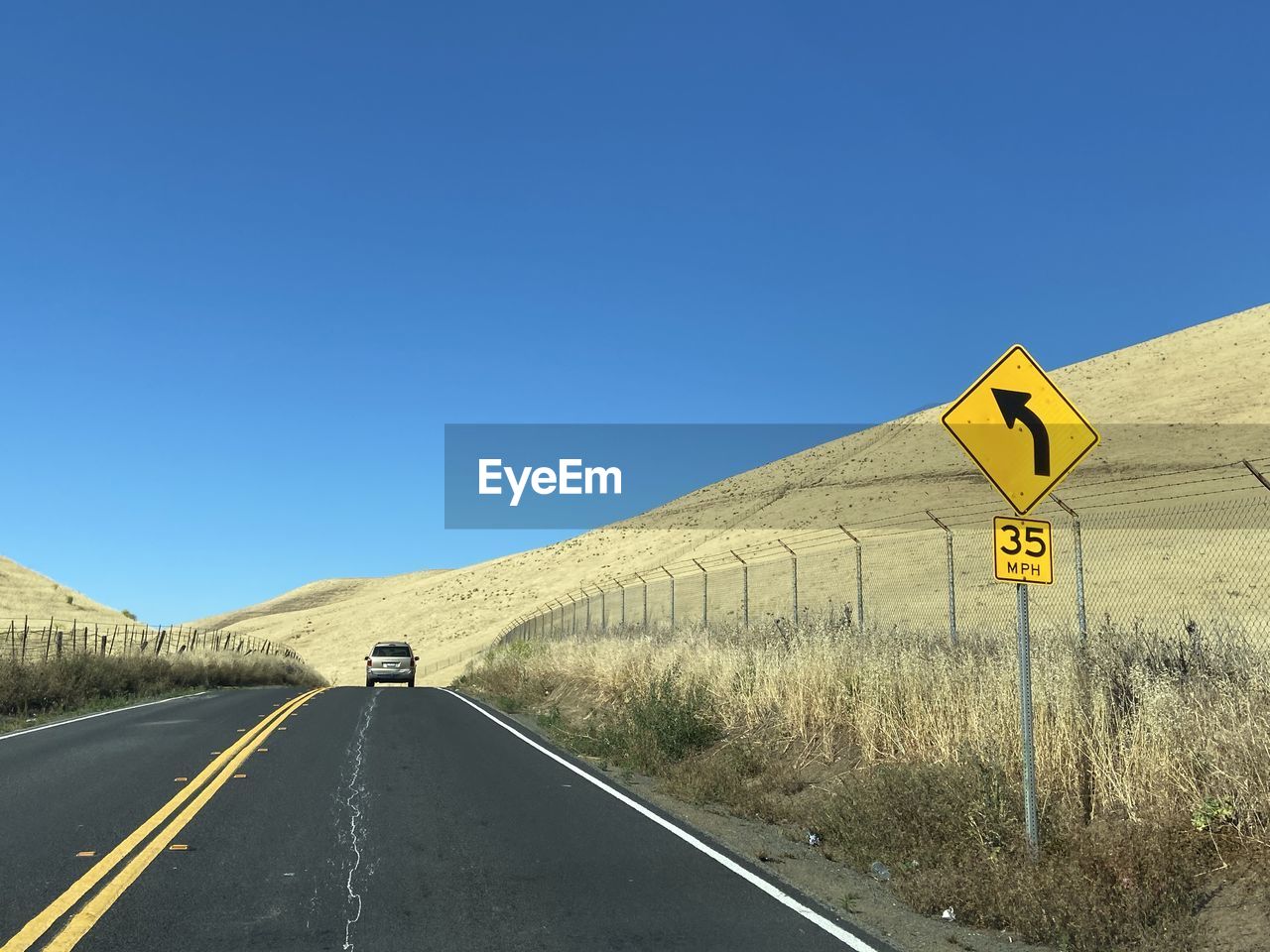 ROAD SIGN AGAINST SKY