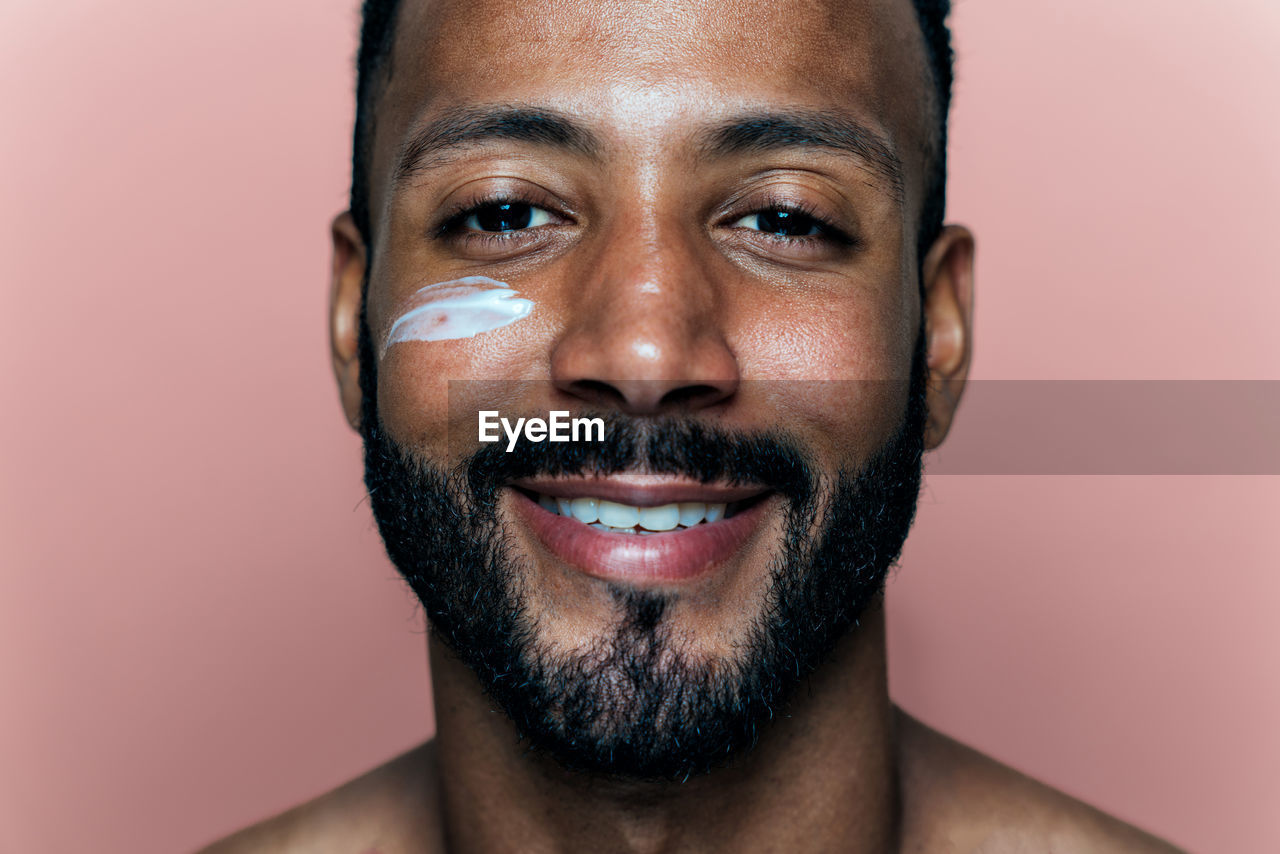 close-up portrait of young man with face paint