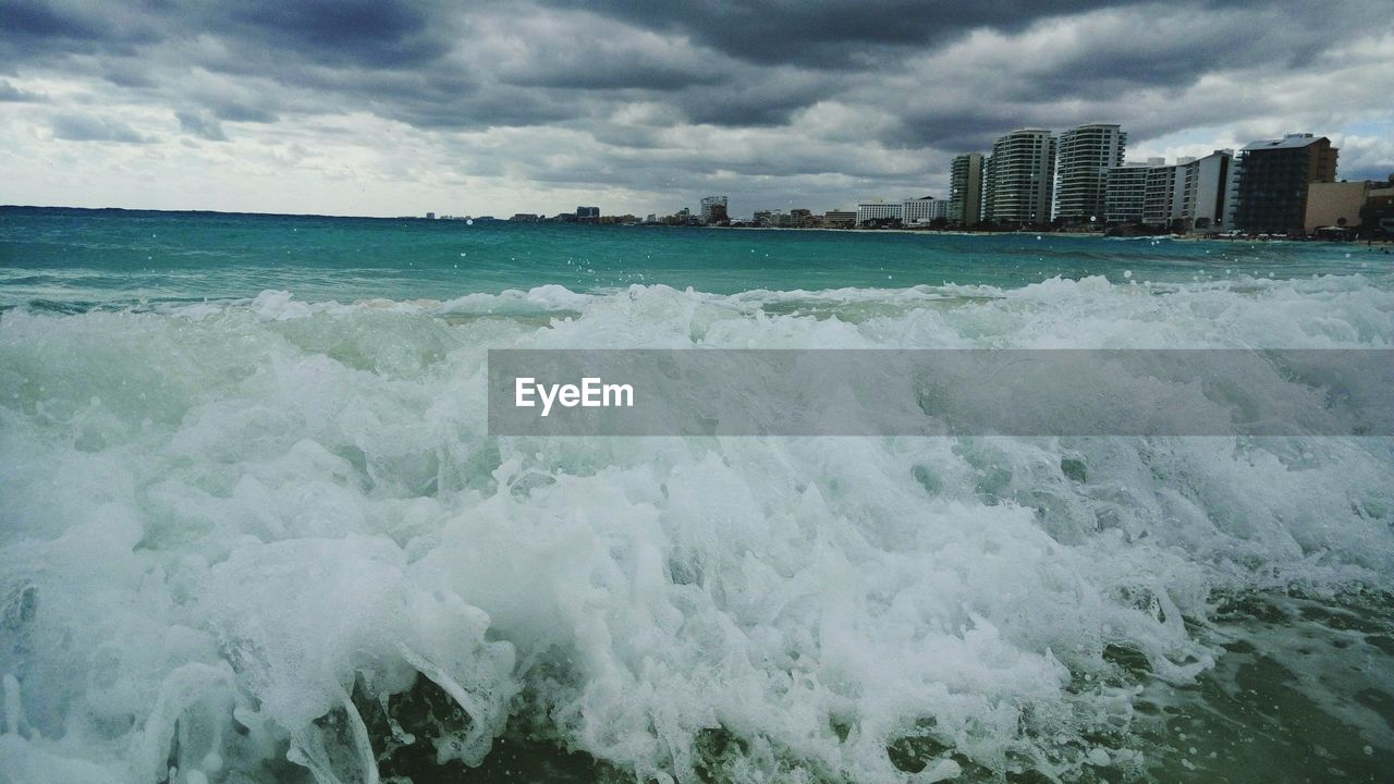 VIEW OF SEA AGAINST CLOUDY SKY