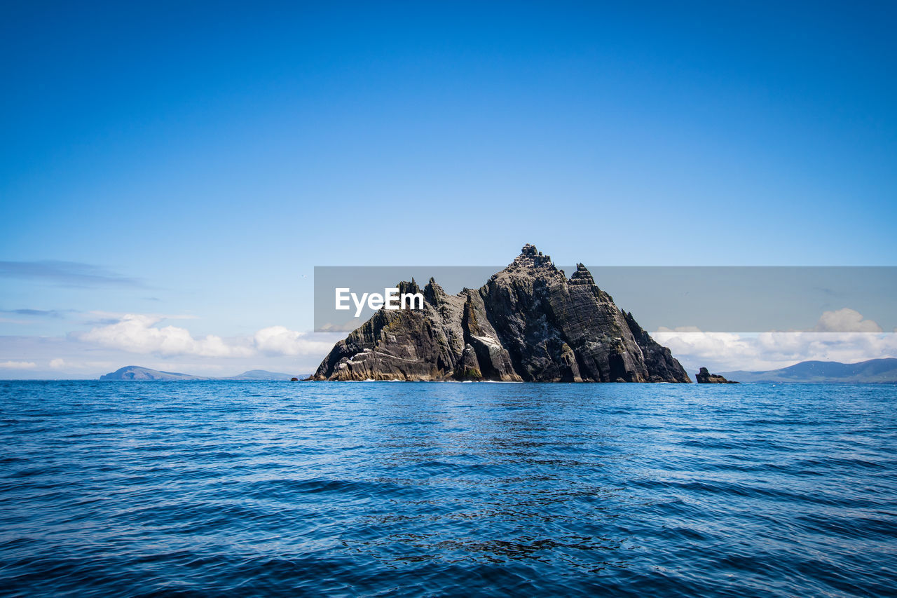 Scenic view of sea against blue sky