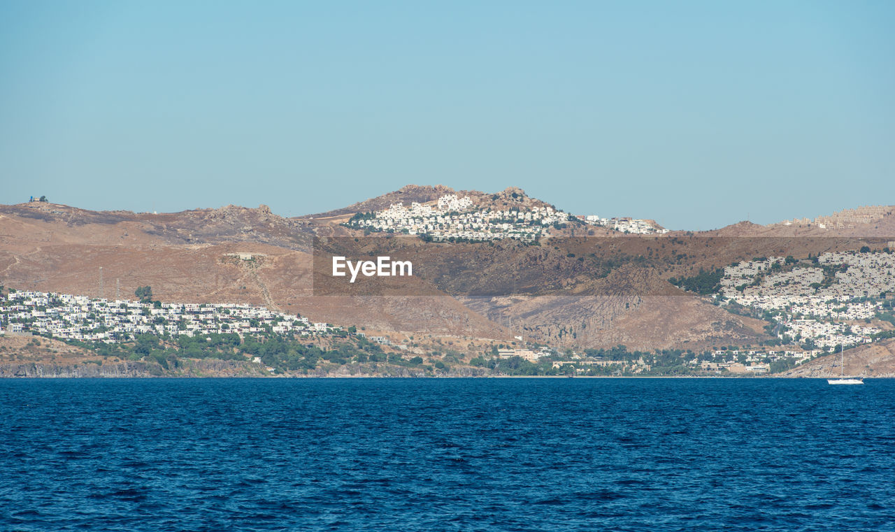 Aegean sea turkish coast and view of the port city of bodrum, boat trip from kos city to bodrum