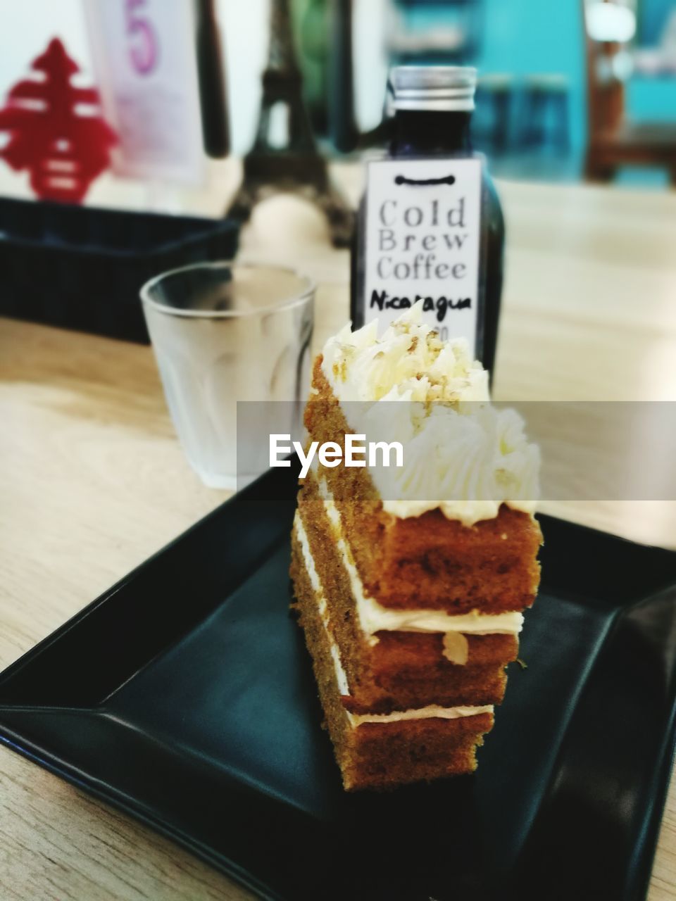 CLOSE-UP OF ICE CREAM ON TABLE