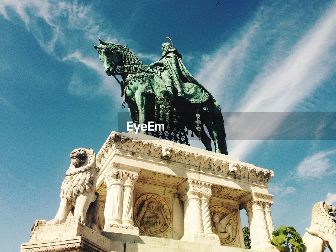 St stephens statue at matthias church against sky