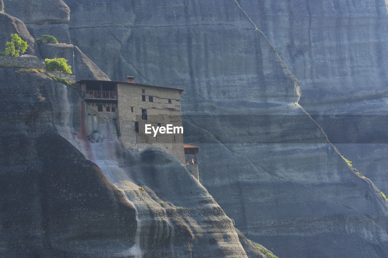 Scenic view of waterfall against mountain