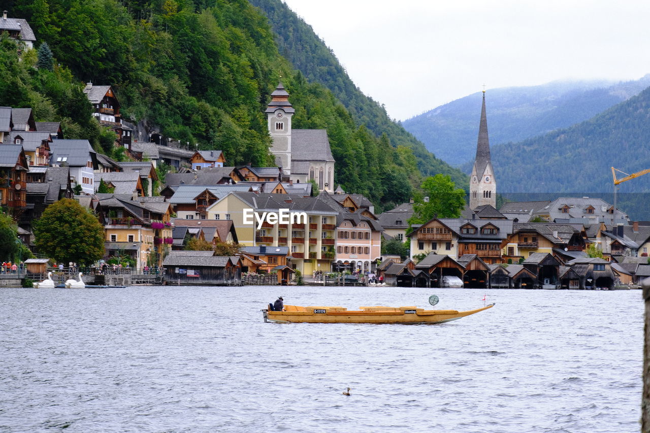 Scenic view of lake against sky at hallstat, austria