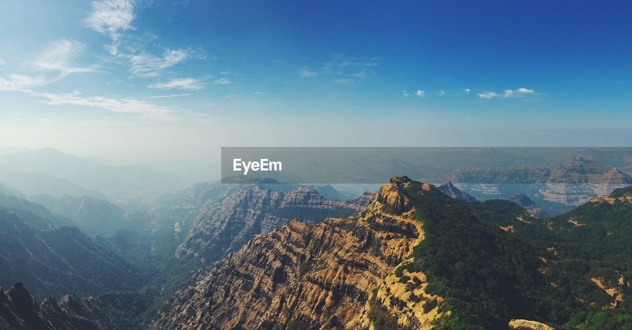 Scenic view of mountains against sky during sunset