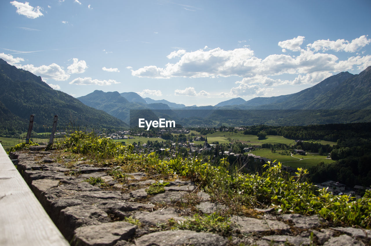 Scenic view of mountains against cloudy sky