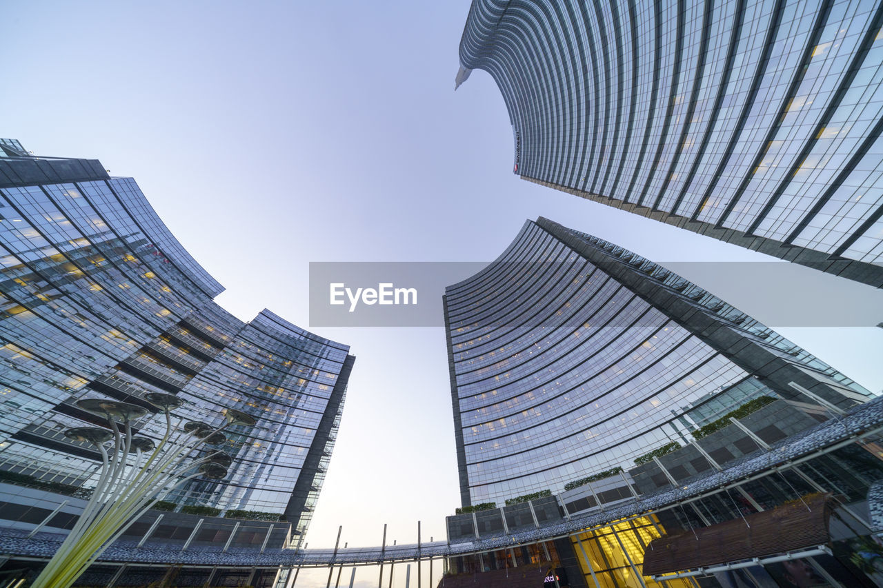 LOW ANGLE VIEW OF SKYSCRAPERS AGAINST CLEAR SKY