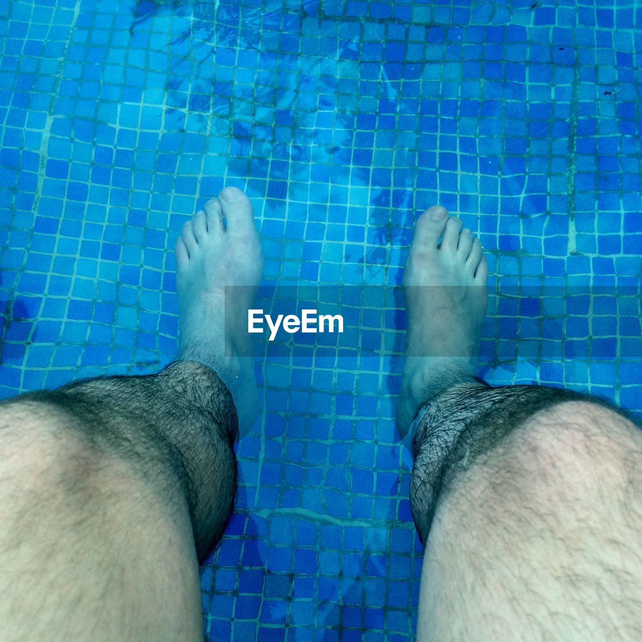 Low section of man in swimming pool