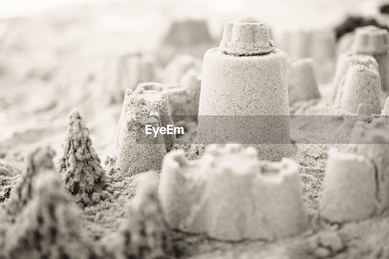 Close-up of sand castle at beach