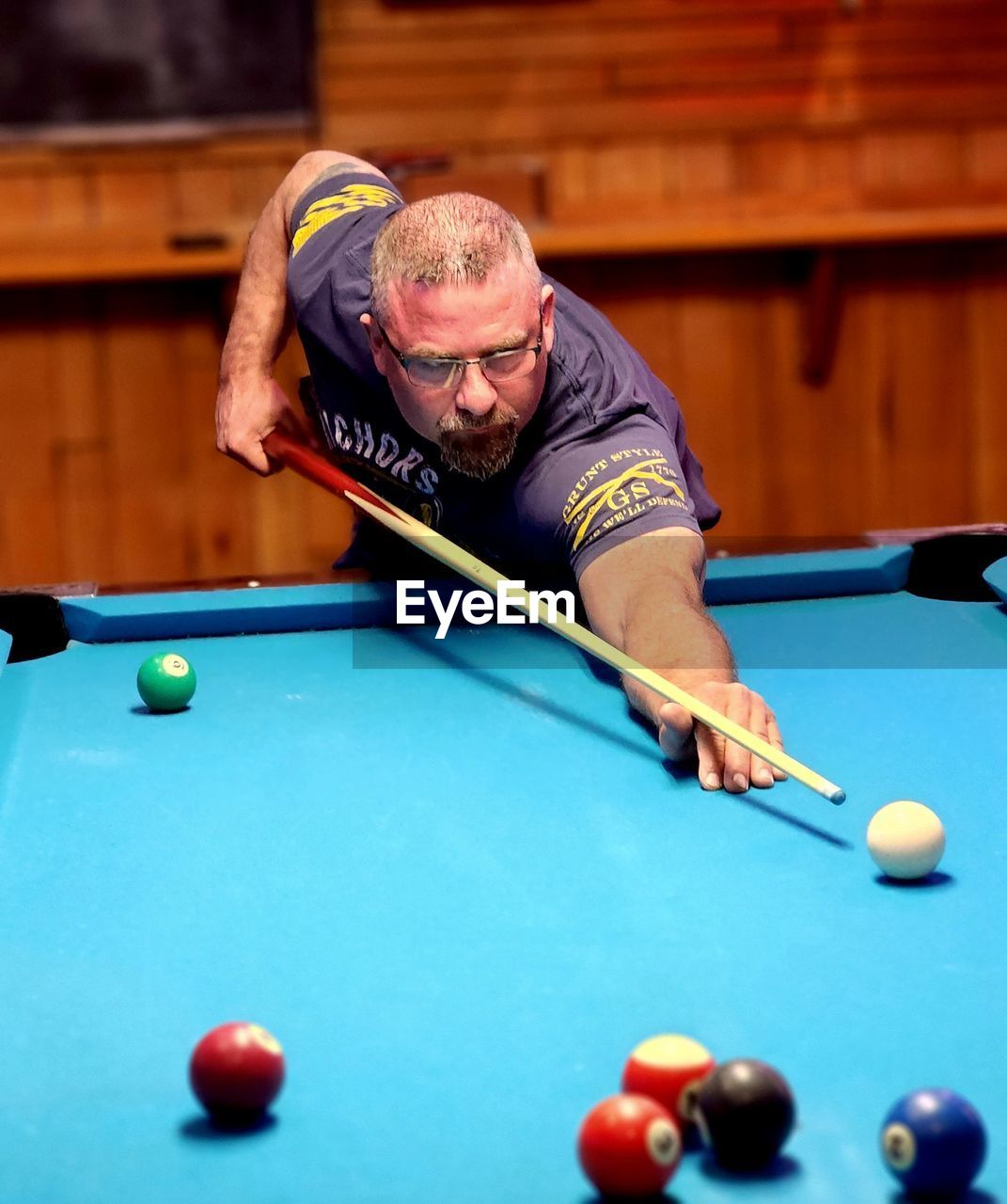 portrait of woman playing pool