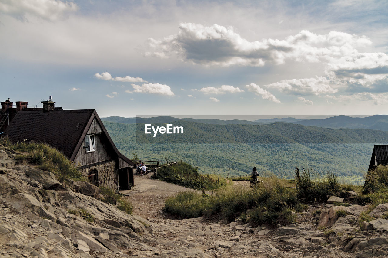 SCENIC VIEW OF LANDSCAPE AND BUILDINGS AGAINST SKY