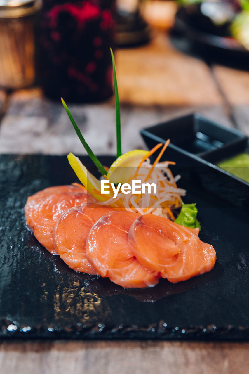 CLOSE-UP OF SUSHI ON TABLE