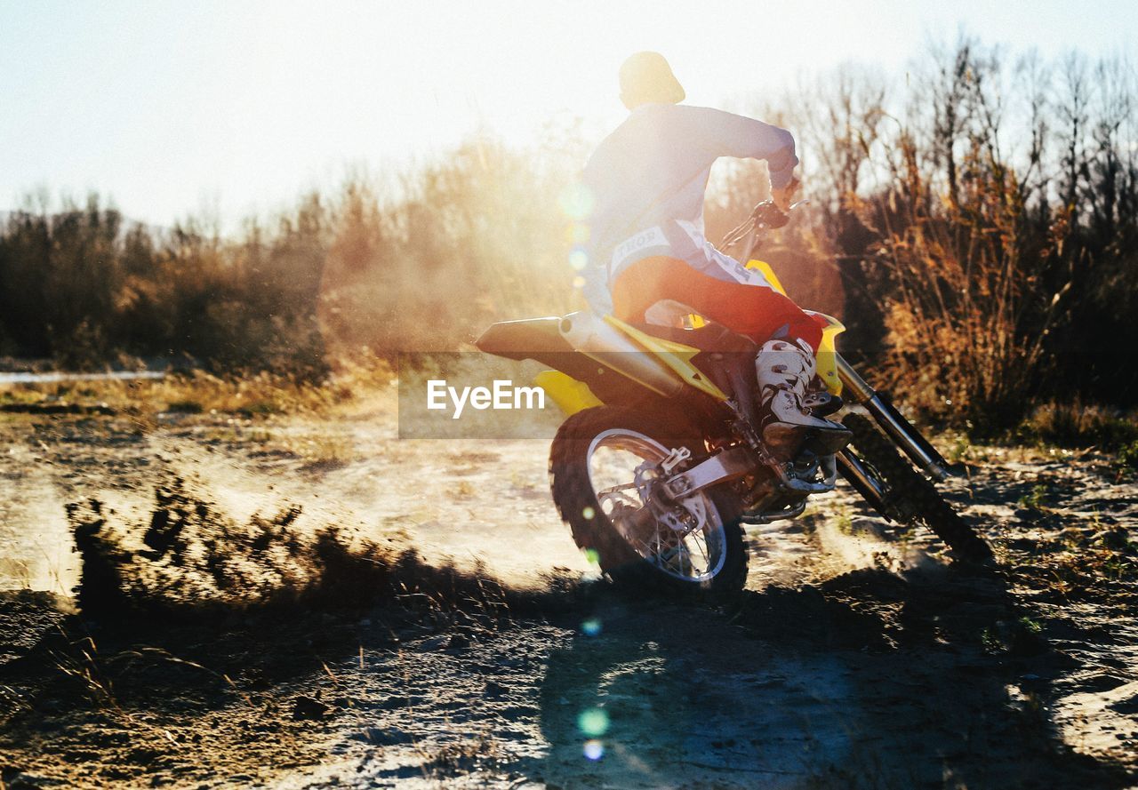 Rear view of person riding motorbike