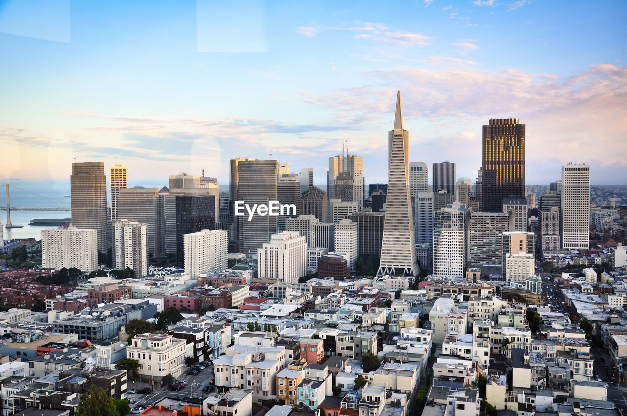 MODERN CITYSCAPE AGAINST SKY