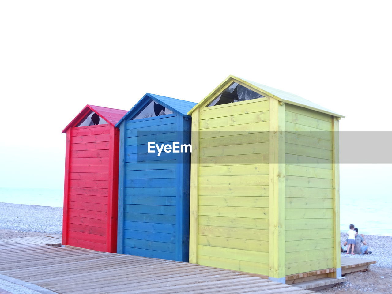 BEACH HUTS AGAINST SKY