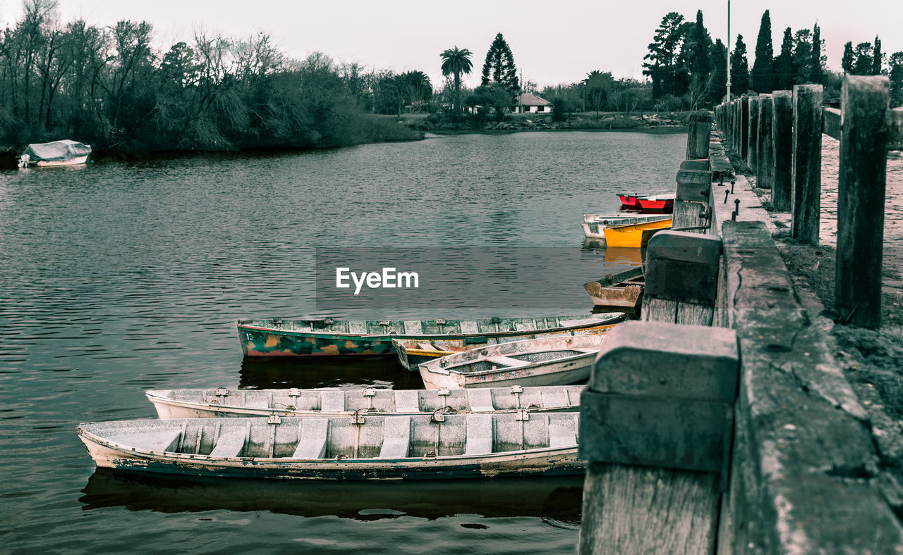 Boats moored in lake