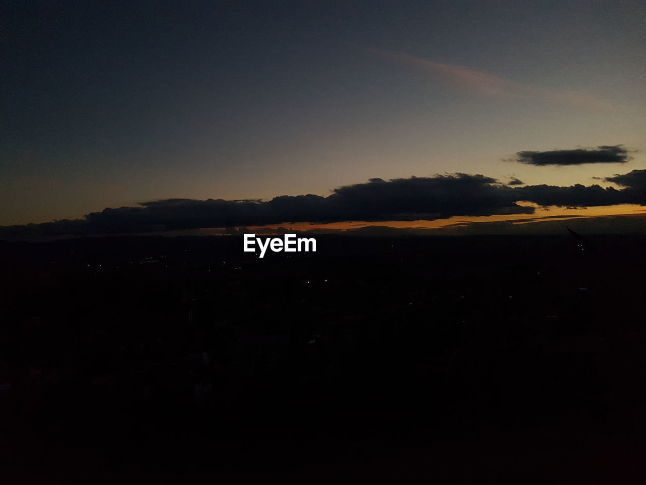 SILHOUETTE LANDSCAPE AGAINST CLEAR SKY DURING SUNSET