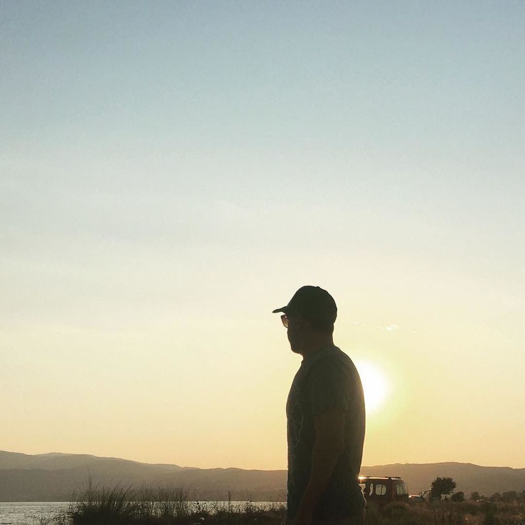 SILHOUETTE OF WOMAN STANDING ON LANDSCAPE
