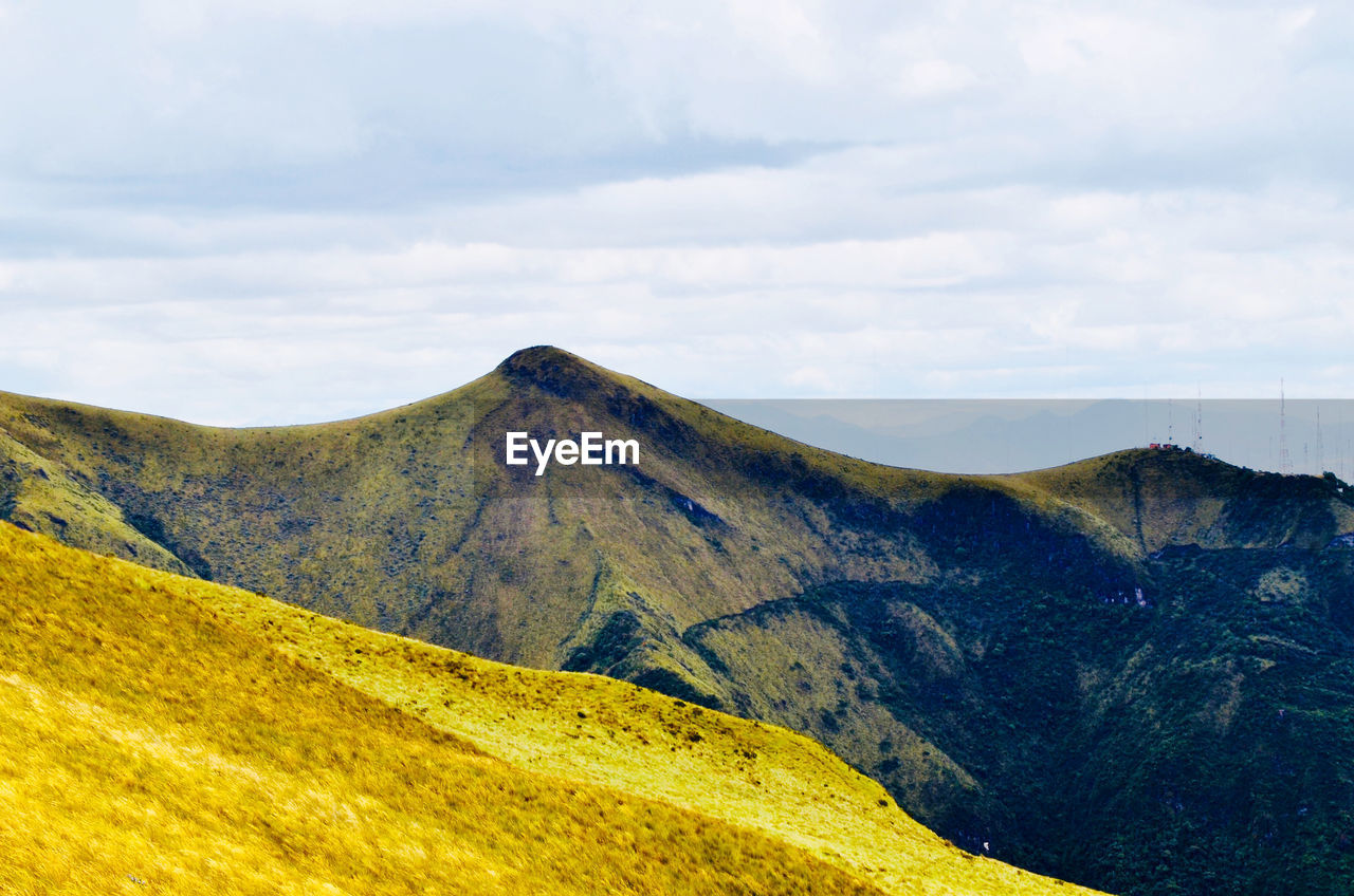 SCENIC VIEW OF VOLCANIC LANDSCAPE AGAINST SKY