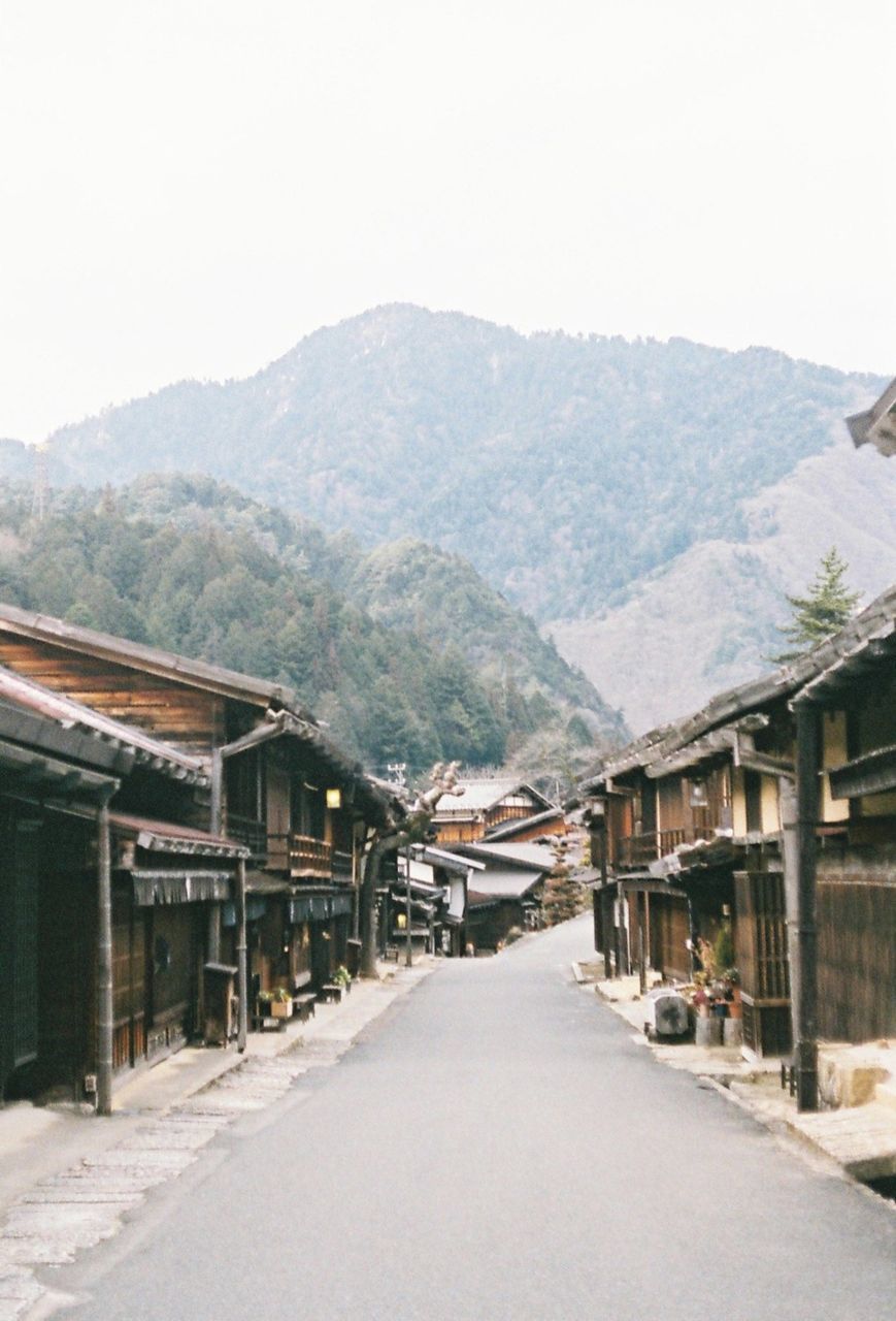 Empty road leading to mountain