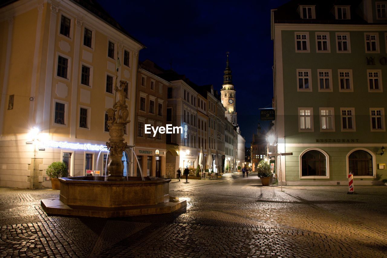 view of illuminated buildings in city at night