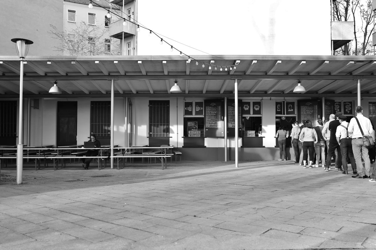 PEOPLE IN FRONT OF BUILDING