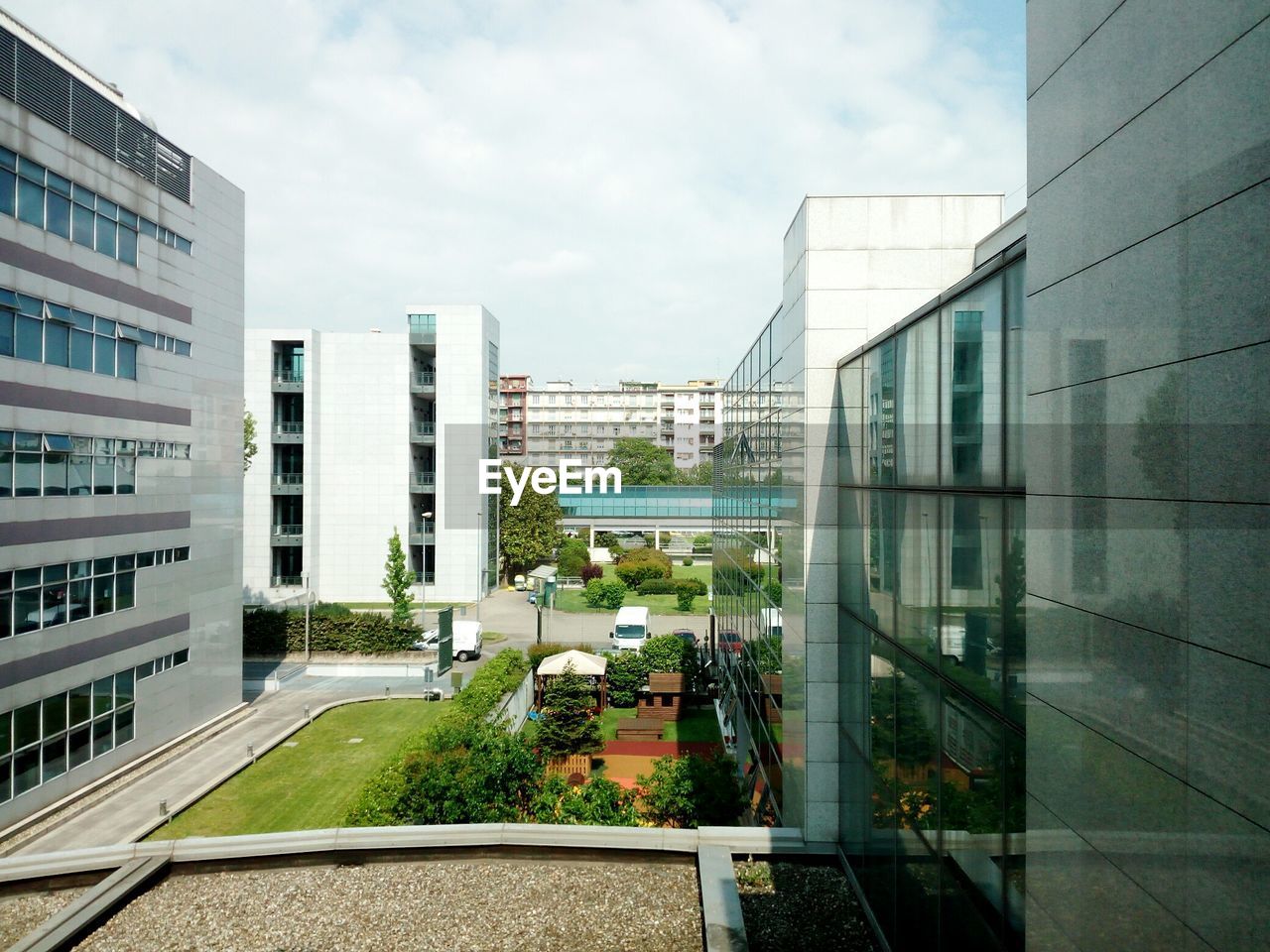 VIEW OF MODERN BUILDINGS AGAINST SKY