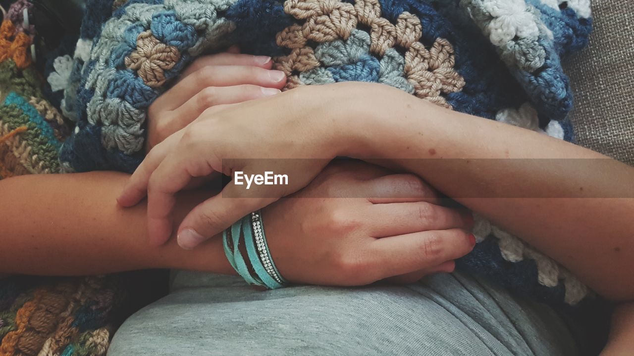 Couple lying on bed at home