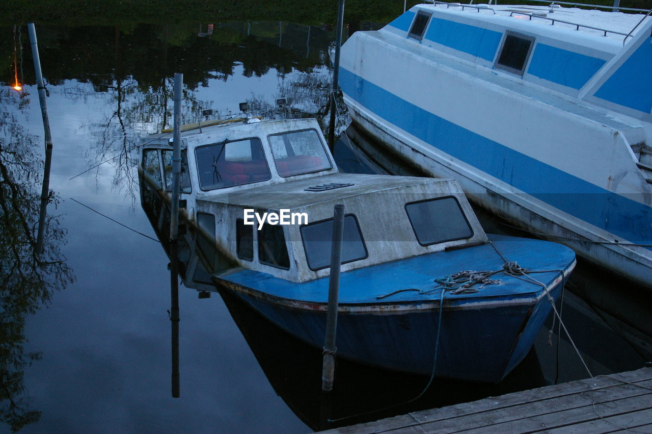 Abandoned boat in water