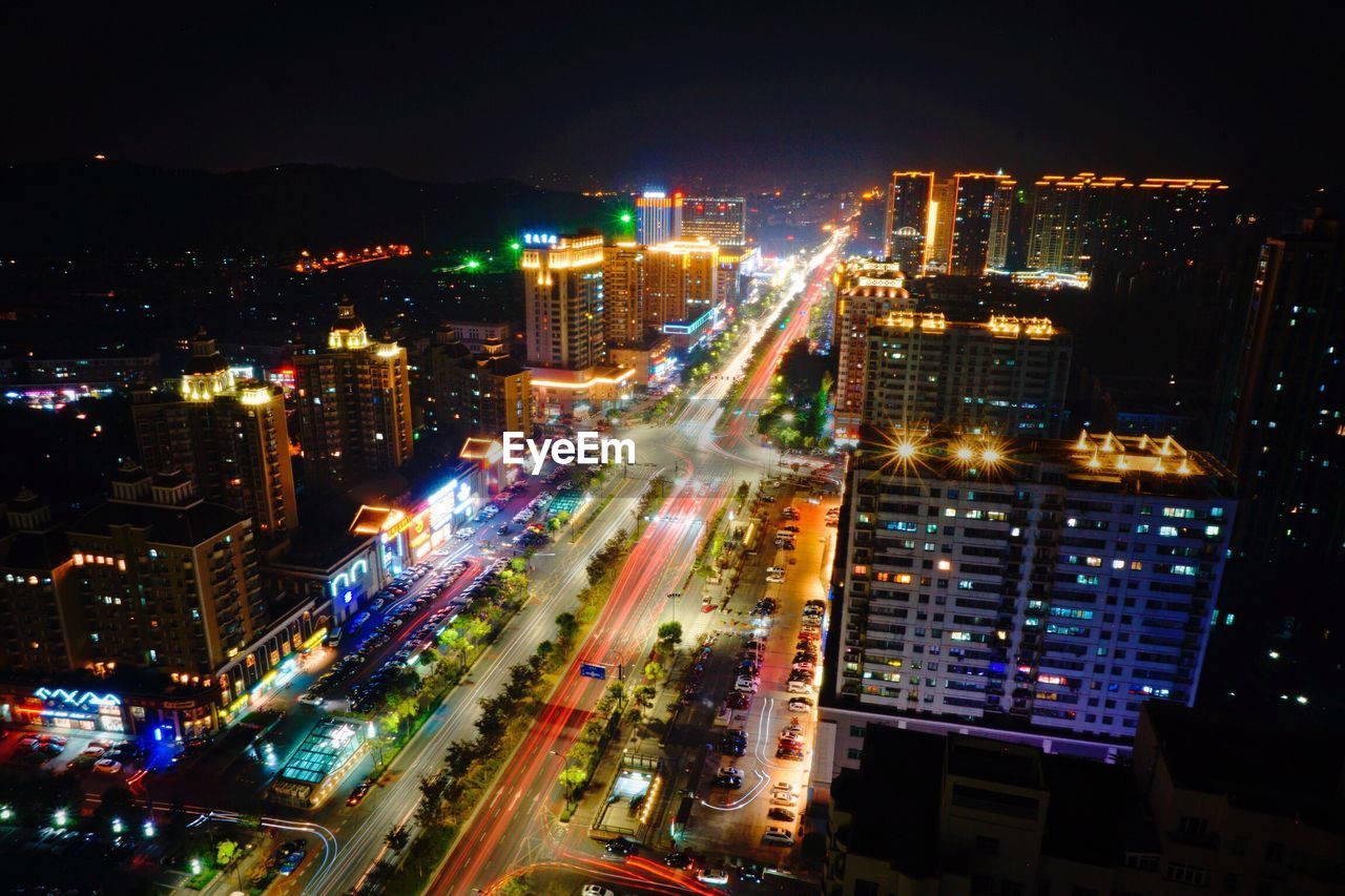 High angle view of illuminated cityscape at night