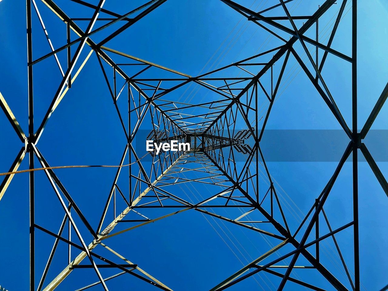 low angle view of electricity pylon