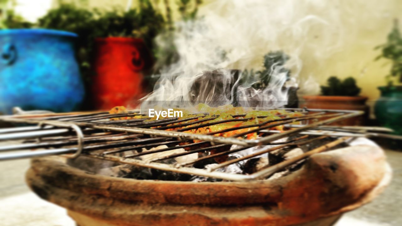 Close-up of meat on barbecue grill