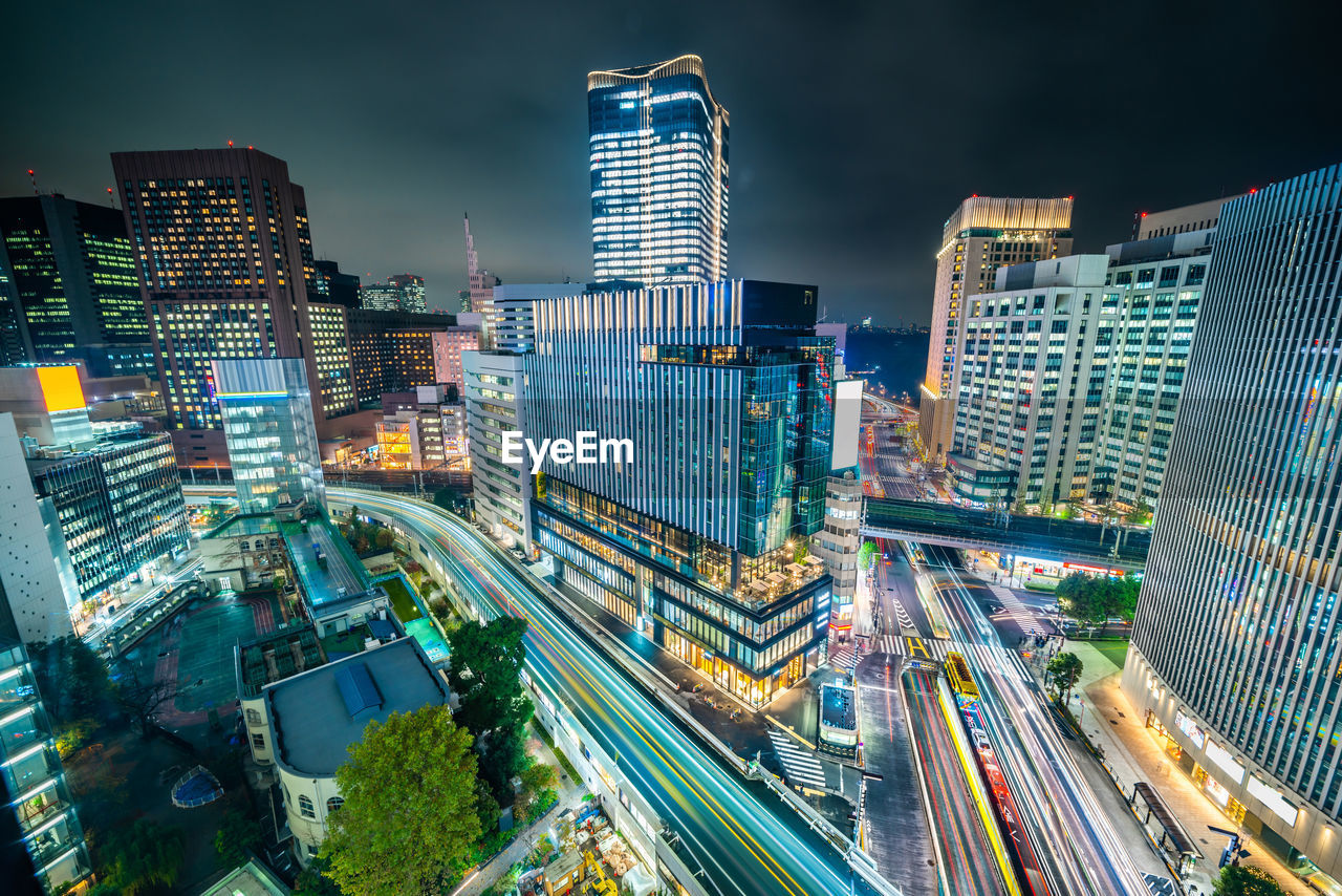 Aerial view of illuminated buildings in city at night